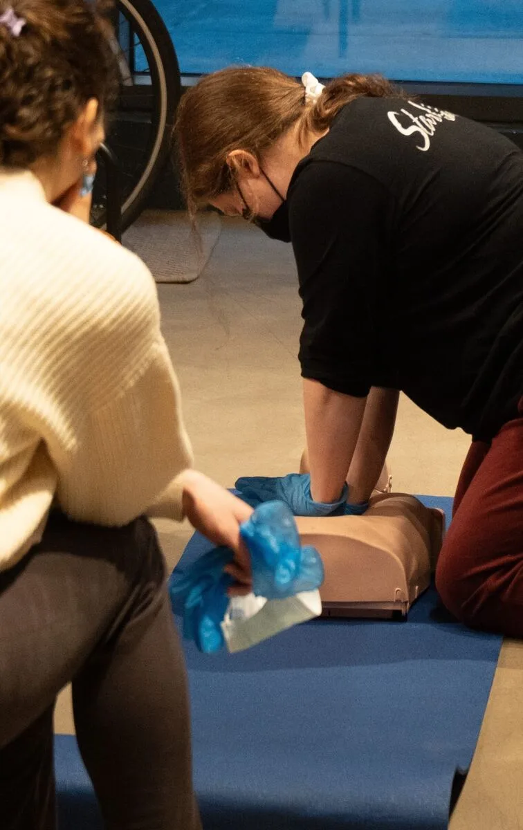 Students practicing CPR during a Wilderness First Aid course
